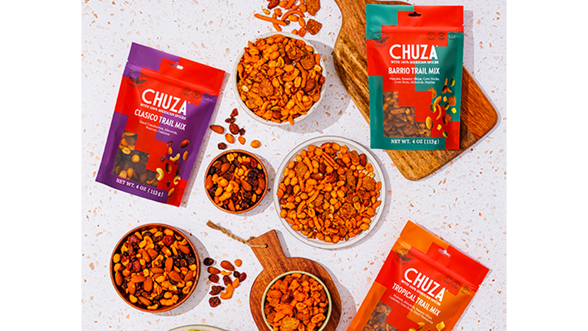 Pouches of Chuza snack mixes on table with bowls