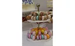 Macarons on a tiered tower, with two tiers.