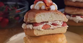  a dish of strawberry stuffed brioche french toast