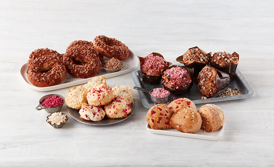 Trays with muffins, doughnuts and other baked goods