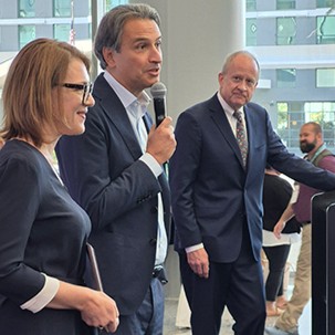 a group of people speaking at the event