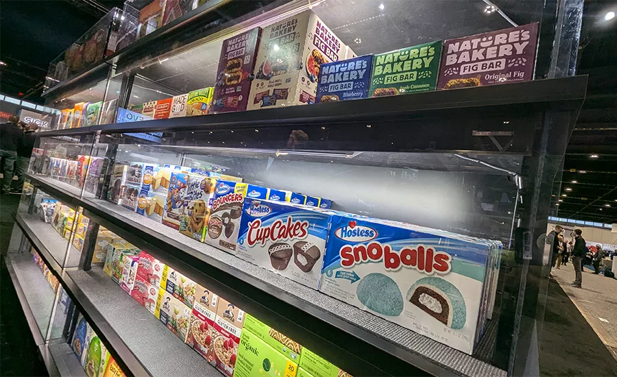a retail shelf stocked with various snack products