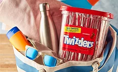 a large container of Twizzlers Strawberry Flavored Twists candy. 