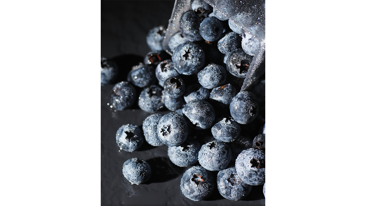 The image features fresh blueberries, which are widely recognized as a nutrient-dense "superfood"