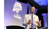 a speaker presenting at a conference focused on food safety protocols and industry advancements. 