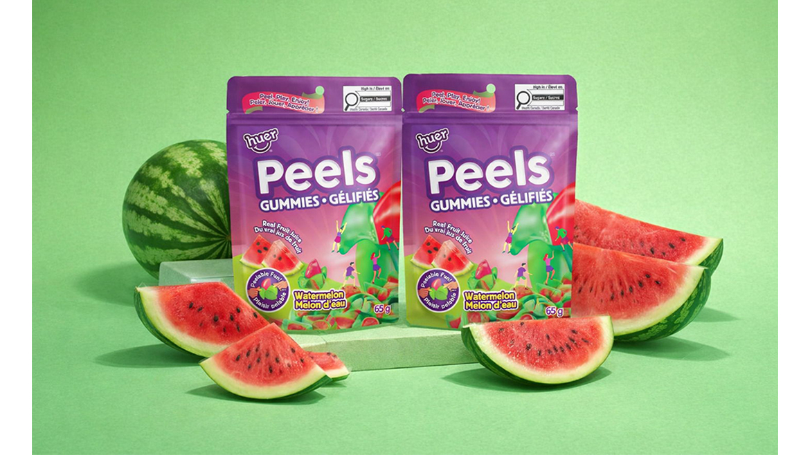 A purple and green bag of watermelon peelable gummies with watermelons in front.