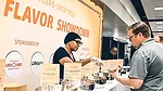 The image displays a "Flavor Showdown" event featuring Texas-inspired seasonings.