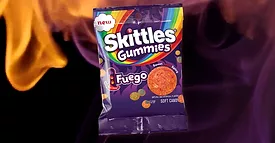 This image displays a package of Skittles Gummies Fuego candy. 