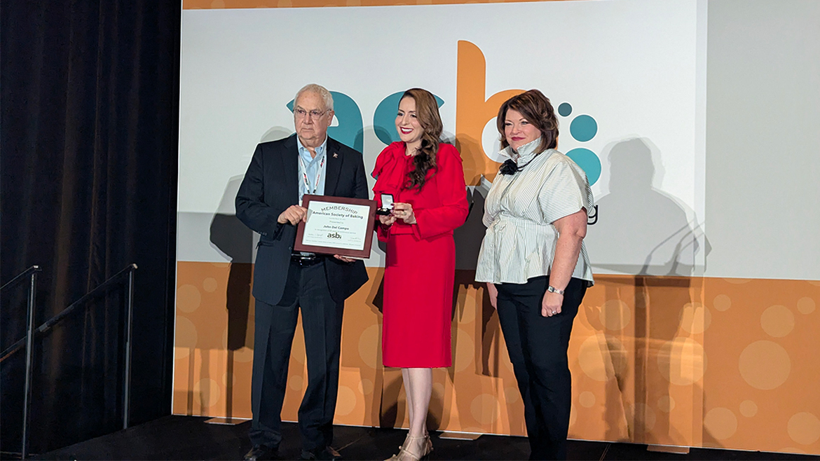 3 people gathered getting an award