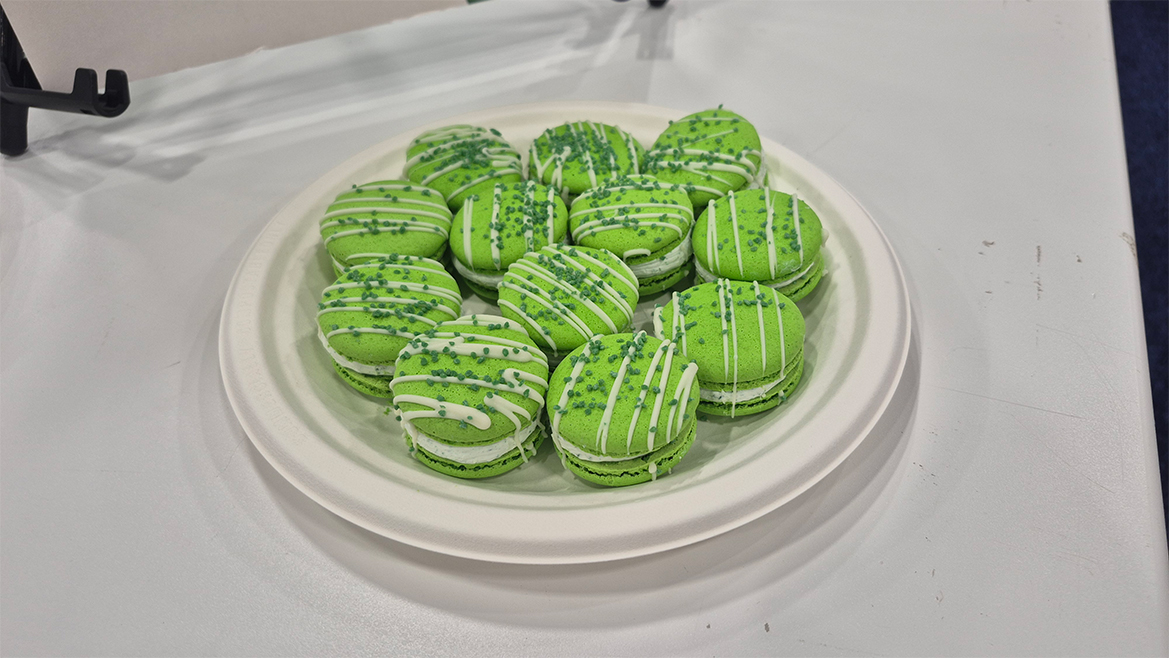 Green macaron-style cookies on a white plate