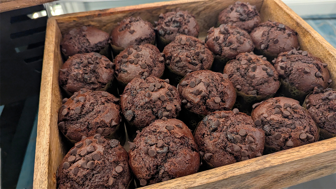 Double chocolate muffins in wooden tray