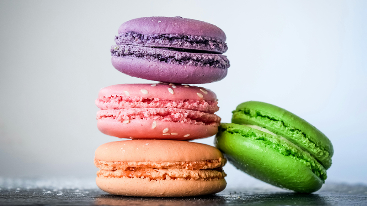 Multicolored macarons stacked on a table
