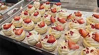 A rectangular-shaped strawberry dessert topped with fresh fruit.