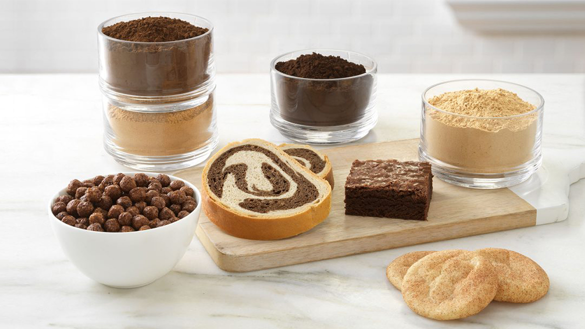 Assorted flours and baked goods on table