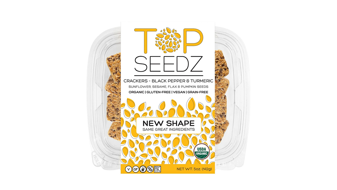 Clamshell container of Black Pepper Turmeric Top Seedz crackers