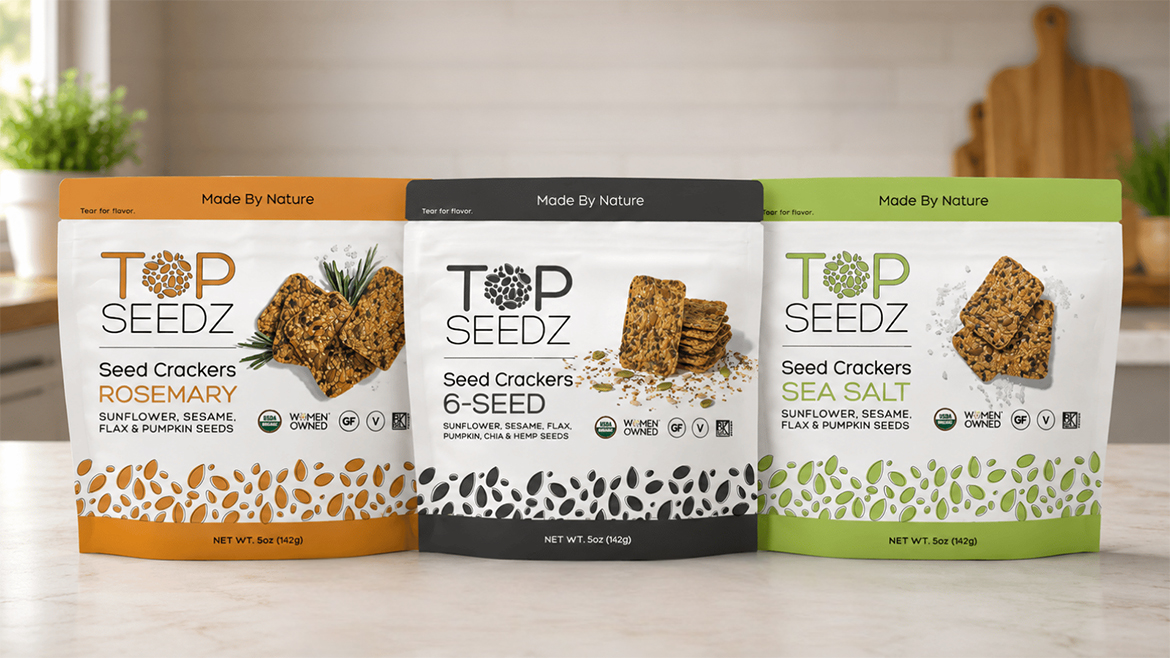 Three pouches of Top Seedz crackers on a counter
