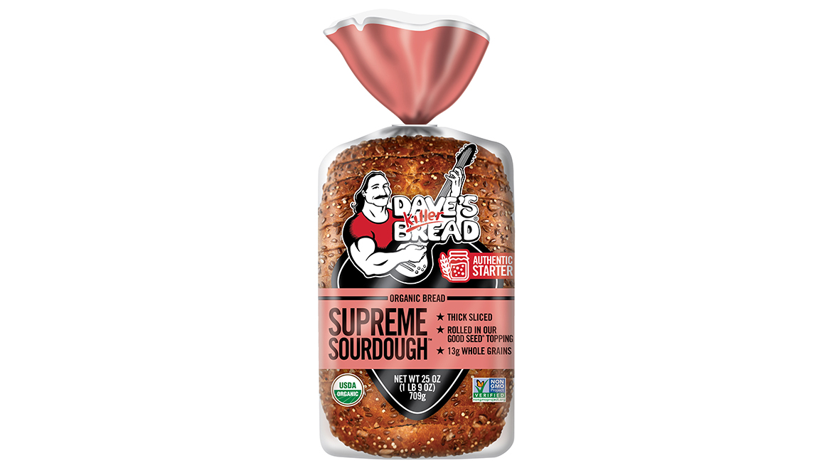 A pink and see-through bag of Dave’s Killer Bread Supreme Sourdough loaf bread.