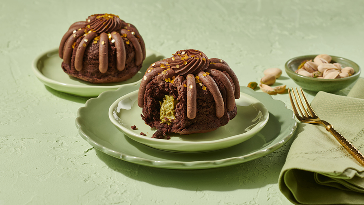 Two Nothing Bundt Cakes Dubai Chocolate flavor on green plates