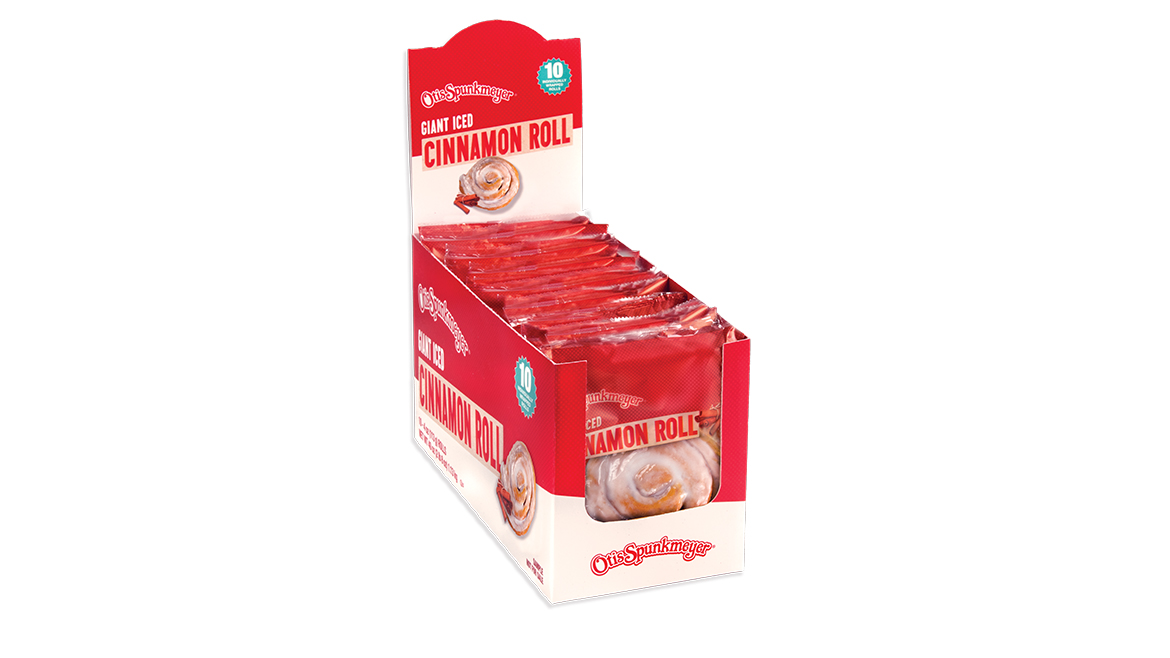 A red and white baked goods caddy with Otis Spunkmeyer Giant Iced Cinnamon Rolls in it.