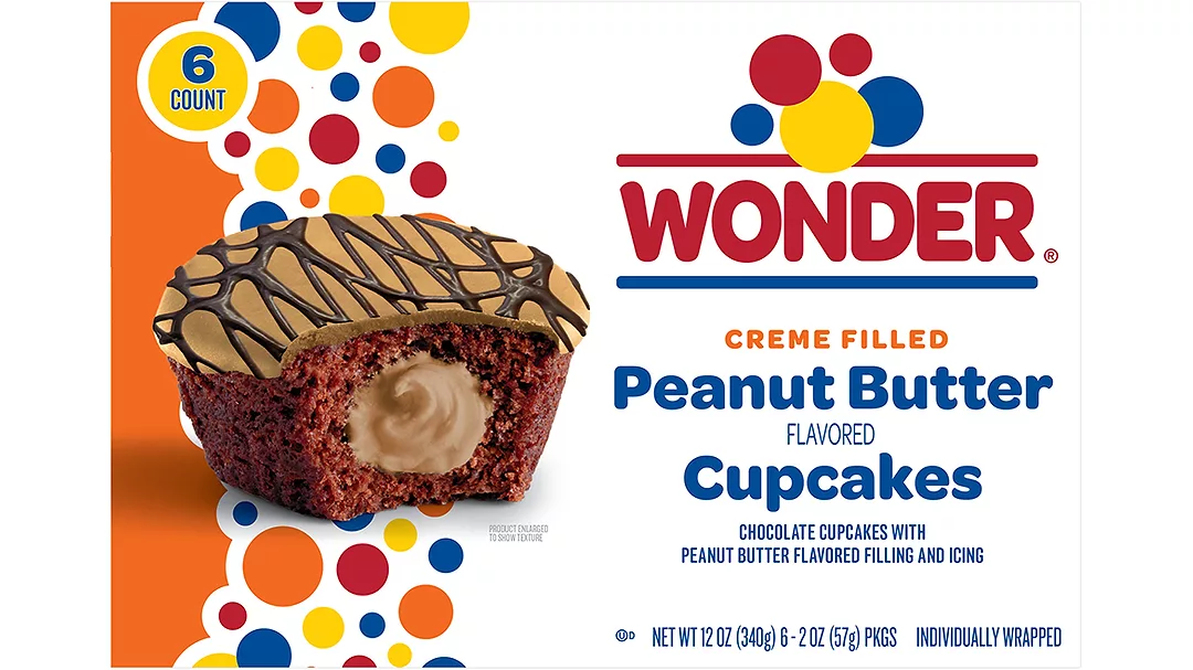 White and orange packaging with a picture of Wonder crème filled peanut butter cupcakes on it.