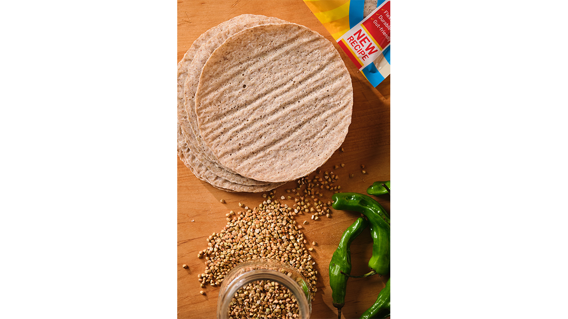 Tortillas on wood table with spices and peppers