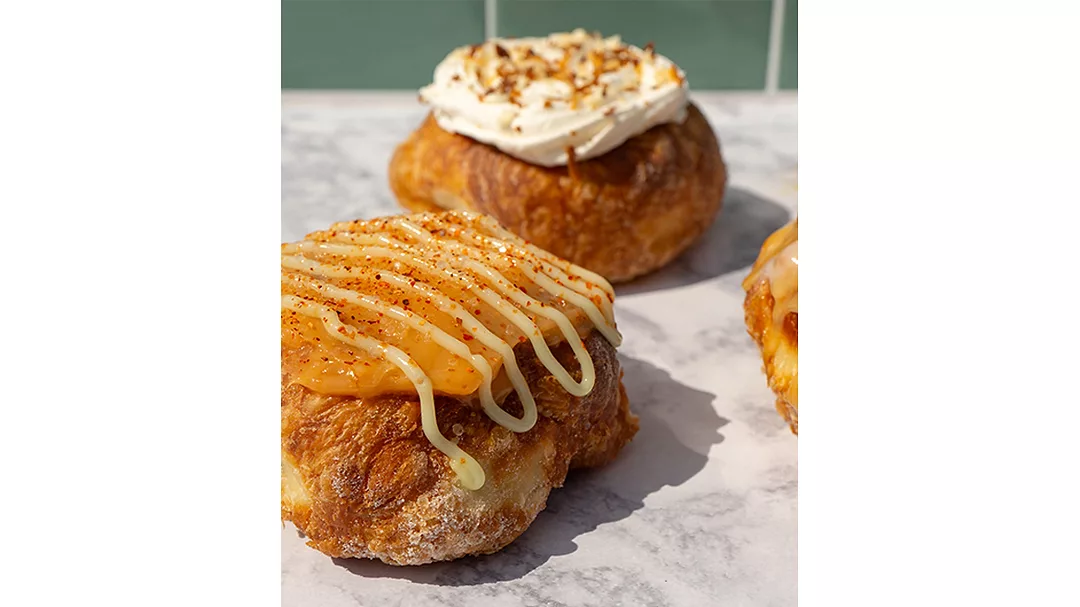 Mango Margarita and Coconut cream doughnuts on table