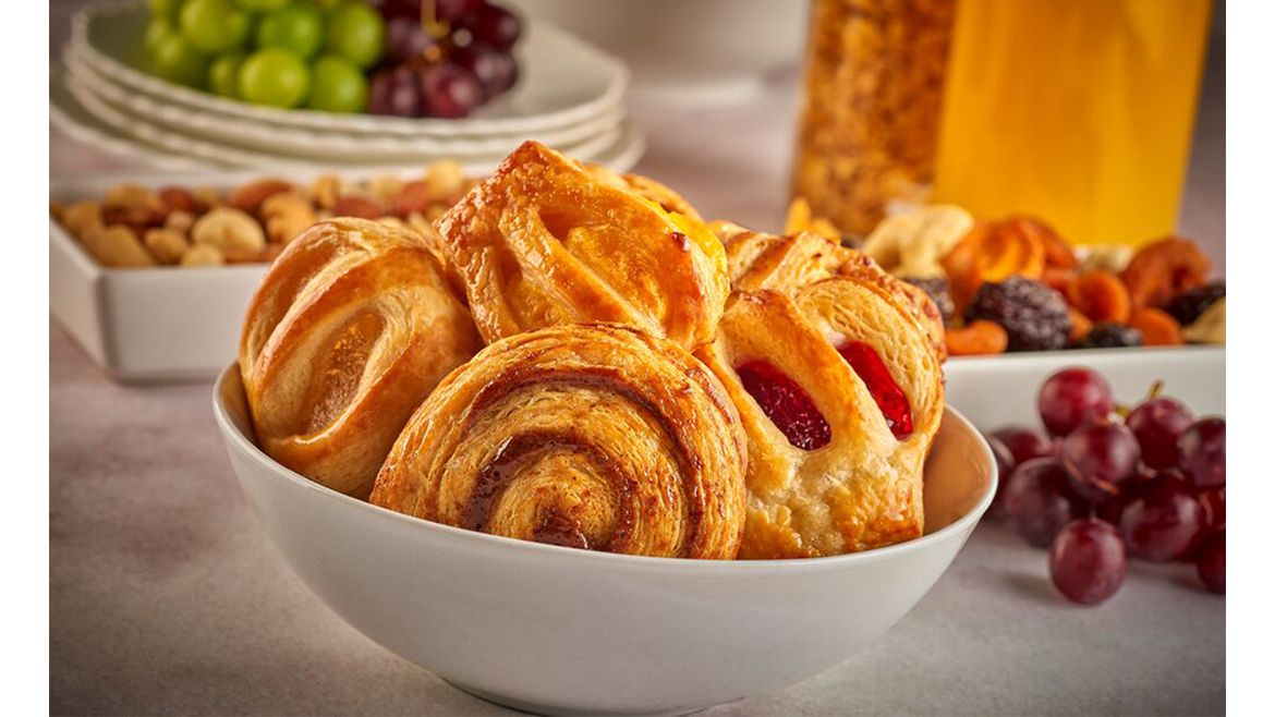 Assorted pastries in a bowl atop a table