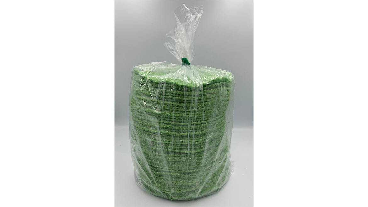 Package of green corn tortillas on white background