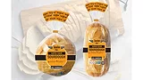 Two loaves of bread, one more round and one more long/rectangular, both in packaging.