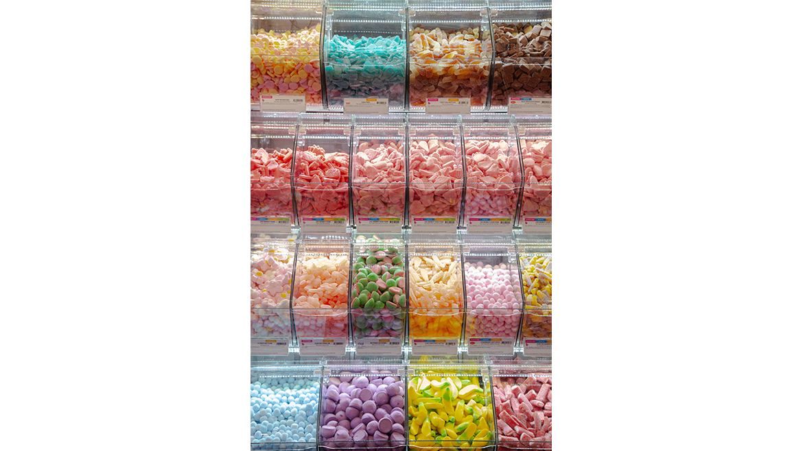 Colorful Swedish grab and go candies, in plastic boxes.