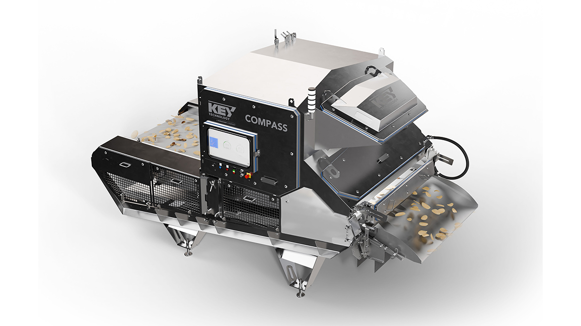 This is a Key Technology COMPASS optical sorter, a belt-fed food sorting system. 