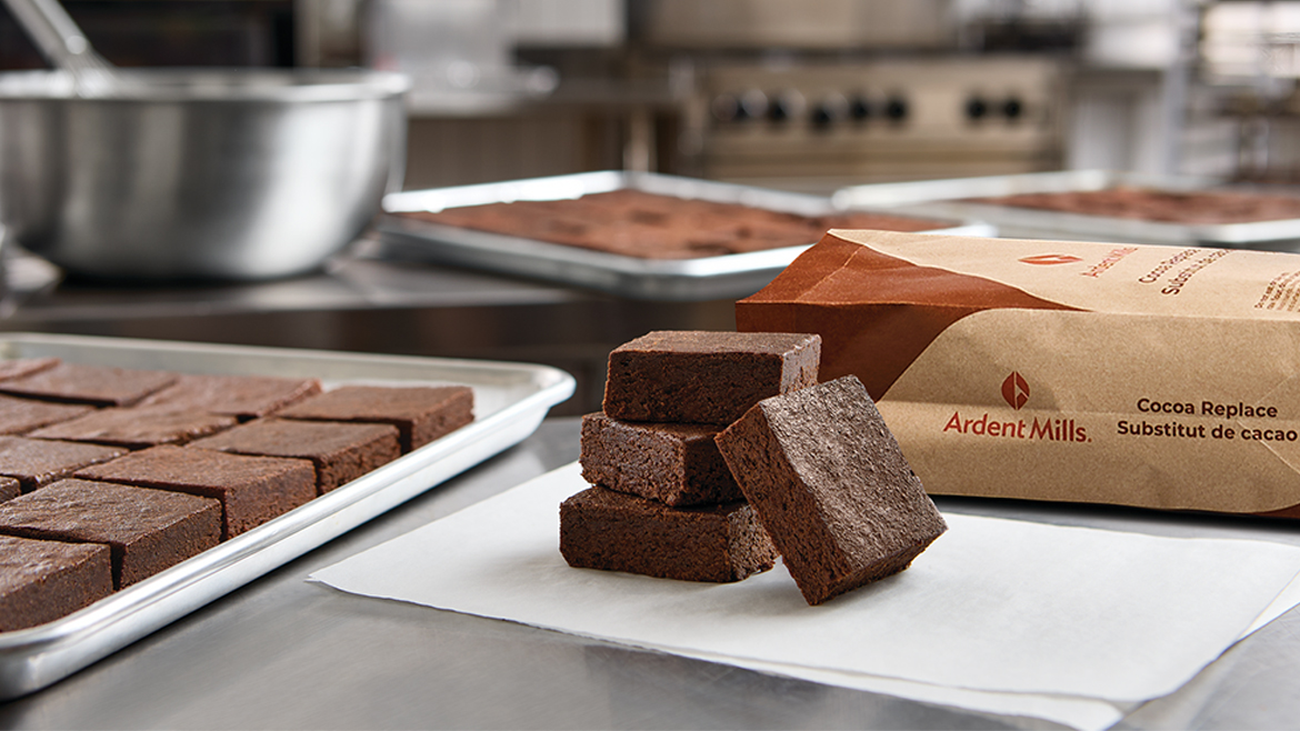 Brownies on a cutting board next to bag of Ardent Mills grain product