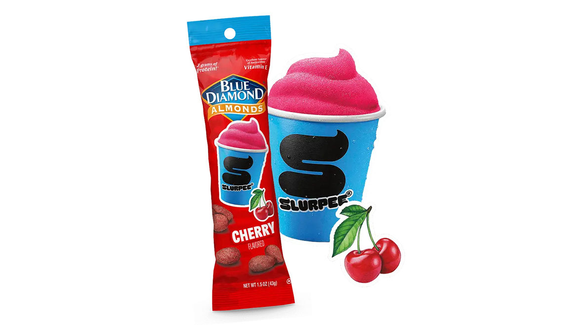 Red and aqua pouch of Blue Diamond almonds next to cherry Slurpee