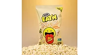 A yellow bag of white cheddar popcorn with actual popcorn in front.