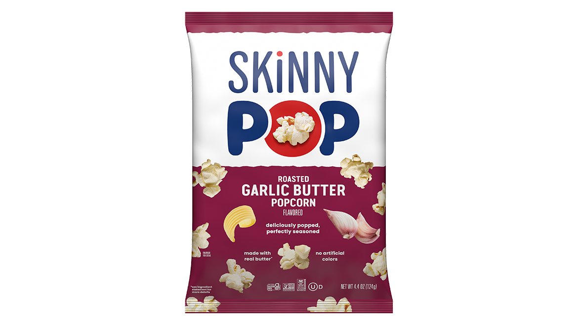 A dark red bag of SkinnyPop roasted garlic butter popcorn.