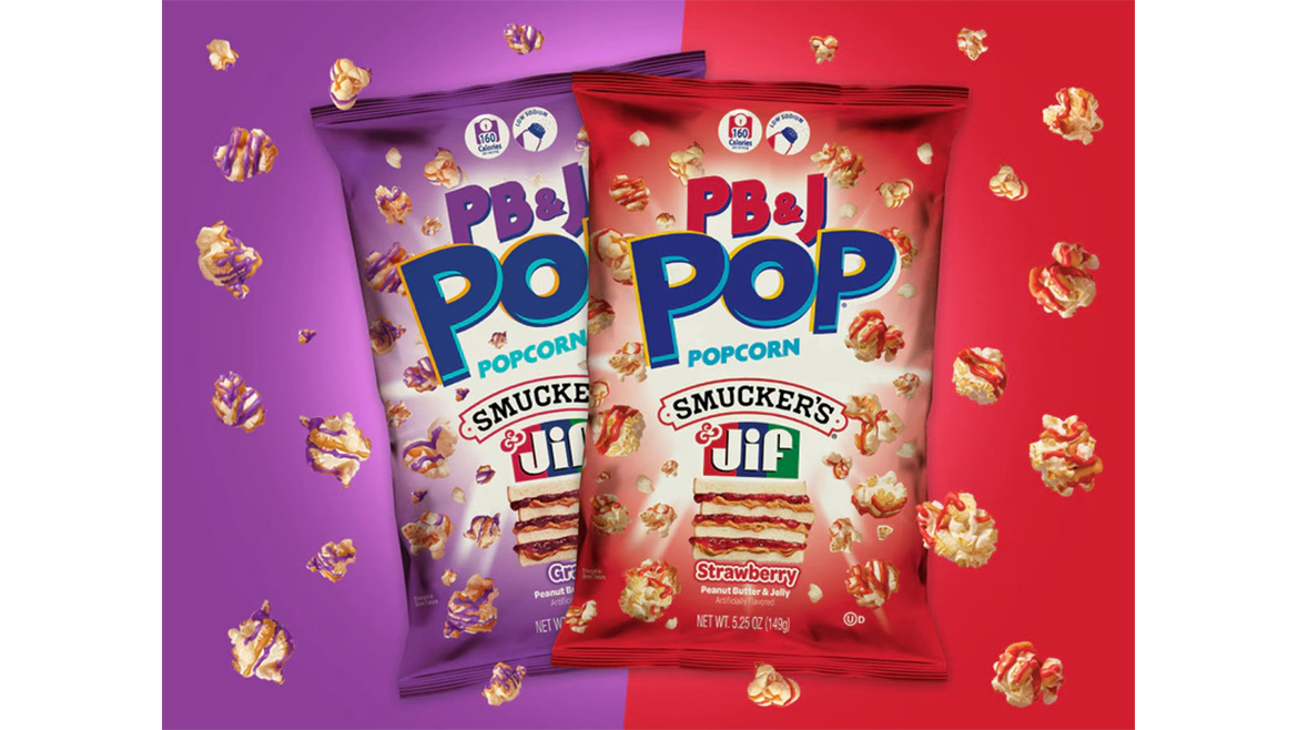 A red bag of PB&J pop strawberry popcorn and a purple bag of PB&J pop grape popcorn against a purple and red background. 