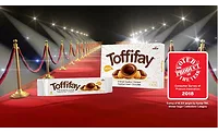 Toffifay Toffifay delivers a highly unique eating experience with its whole roasted hazelnut, chewy caramel cup, hazelnut cream and drop of chocolate.