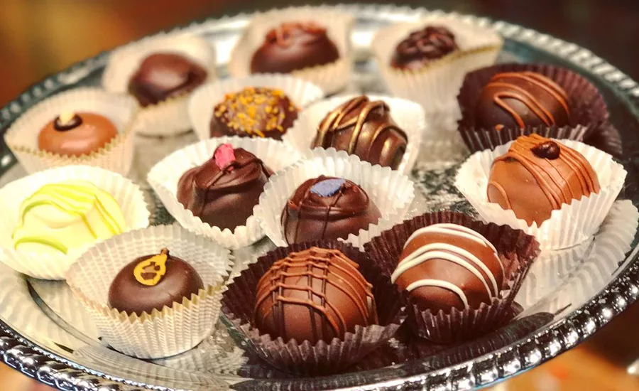 Award-winning chocolates are served on a silver platter.